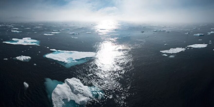 Greenland Sea, open water with broken icebergs, sun reflection, william bosen via unsplash